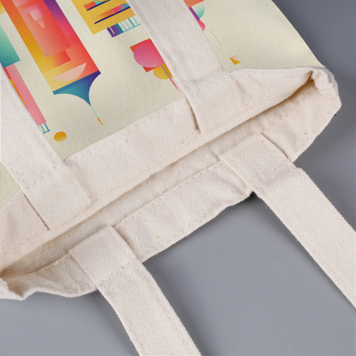 This canvas bag with a cartoon castle print has a wide shoulder strap.